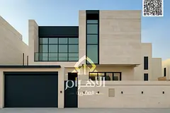 **Luxury villa for sale in Al Bahia - Ajman | Two floors + roof with a modern design | 5 master bedr