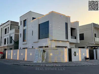 Corner villa for sale in Al Yasmin, two floors and a roof, price includes services.