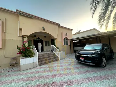 Villa in Al Muwaihat 3, Ajman, steps away from the school complex and the Saudi German Hospital. Includes electricity, water, and air conditioning. 64