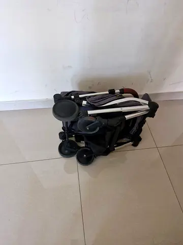 Compact foldable baby stroller in good condition