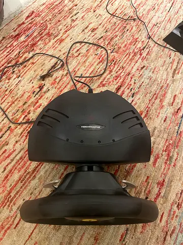 A thrustmaster  Ferrari steering wheel with pedals