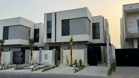 Luxury villa for sale in Al Zahia, Ajman, on Emirates Road exit, including electricity, water, and air conditioning, at a special price.