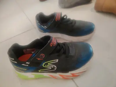 Blue kids light-up sneakers, size around EU 33/34
