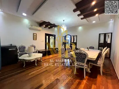 A luxurious corner villa in Al Rawda 1, boasting a prime location and high-end finishes, is available at a price inclusive of electricity, water, and