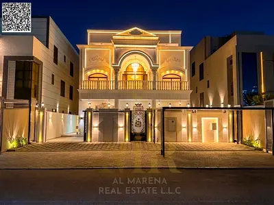 Villa in one of Ajman's most prestigious areas, on a main street, with a price including electricity, water, air conditioning, and elevator.