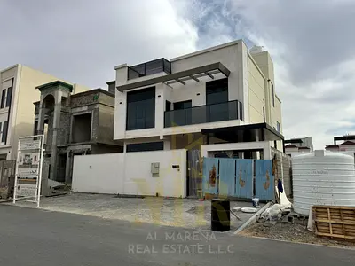 Two-story villa with a rooftop terrace, at a special price including registration and ownership fees, in one of Ajman's most prestigious areas. Freeho