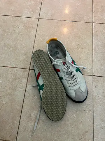 Casual white sneakers with green/red accents - lightly used