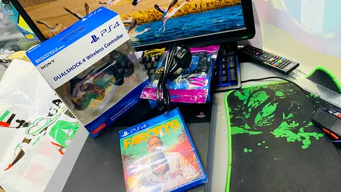 Used PS4 console with monitor controller and 4 game CDs - Good Working Condition