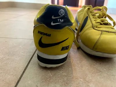 Yellow Nike-style casual sneakers, used (pair)