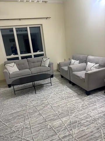 Light grey 3-seater sofa set with matching rug and coffee table