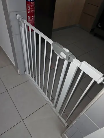 White baby safety gate — good condition