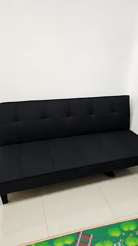 Black fabric sofa bed / futon - good condition