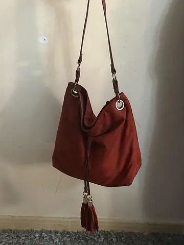 Brown suede crossbody bag with tassel
