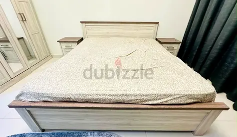 A king size bed and Matching Nightstands , 4 door wardrobe , premium matress, study desck with chair