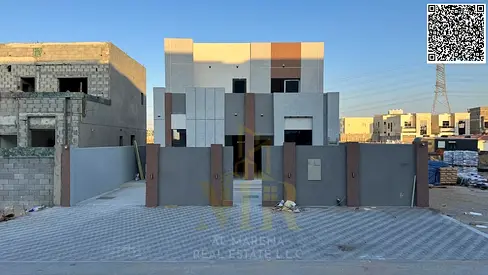 Modern villa with roof in Al-Haliyo 2, elegant design, price includes registration fees, electricity, and water.