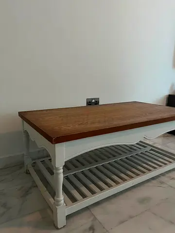 Coffee table with bottom storage