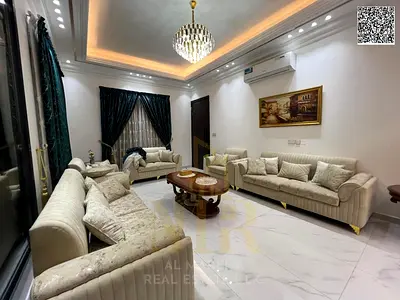 Villa in one of Ajman's most prestigious areas, on a main street, with a price including electricity, water, and air conditioning, located close to am