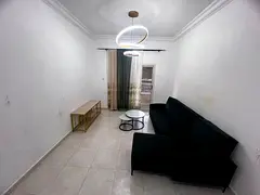 2BHK in Gulf Tower Emirates City, unfurnished, central AC, free parking and prime location.