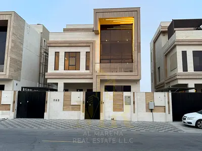 A luxurious two-story villa with a rooftop terrace and swimming pool in Al Bahia. Modern design and a tranquil location.