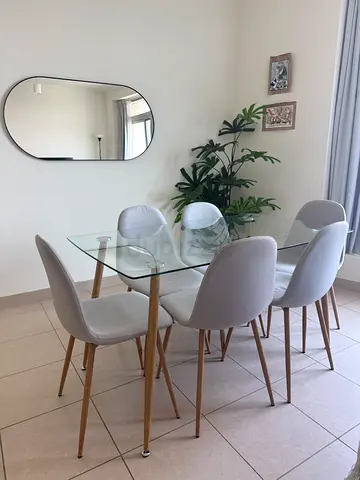 Glass Top Dining Table with 6 Light Grey Upholstered Chairs