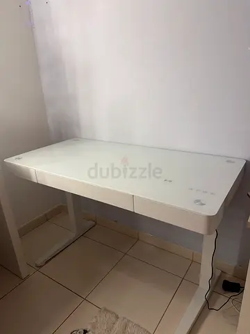 Modern White Desk with Bluetooth speaker, drawer, and glass top