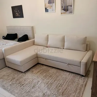 Light beige L-shaped sofa with storage good condition