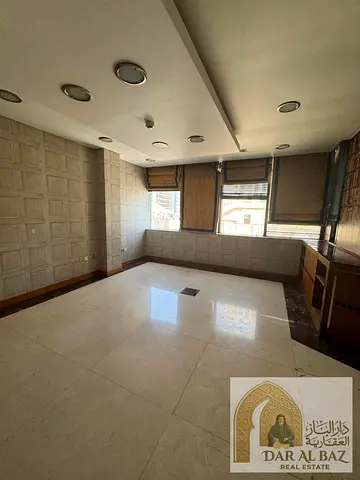 Office for annual rent in Al Majaz 1. The office is divided into 6 rooms with a large reception area and includes free air conditioning. The office is