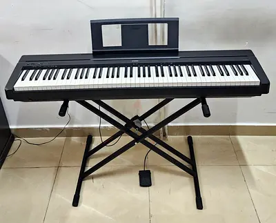 The Yamaha P-45B (Black) is a compact, 88-key entry-level digital piano. It features weighted Graded