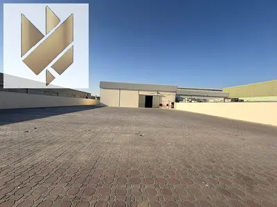 Enclosed yard with a warehouse for rent in Industrial Area 18, featuring a prime location within the industrial zone.