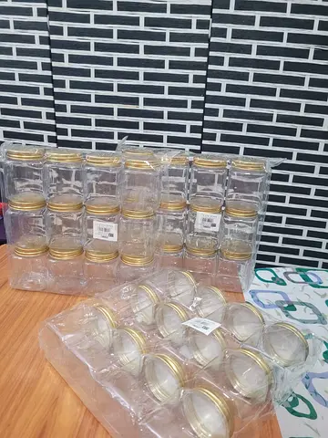 MOVING OUT SALE: Lot of small glass jars with gold lids - new, sealed (x24)