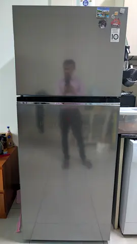 Silver top-freezer refrigerator - good condition, 2-door