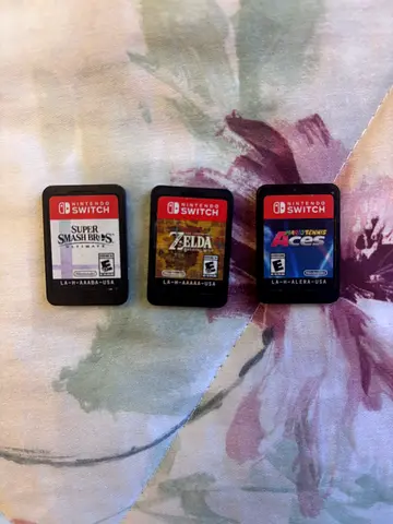 Lot of 3 Nintendo Switch Games: Super Smash Bros, Zelda, and Mario Aces