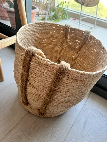 Handwoven storage basket with handles