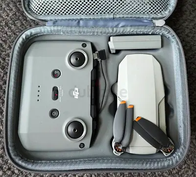 DJI Mini series foldable drone with controller and spare battery (excellent condition)