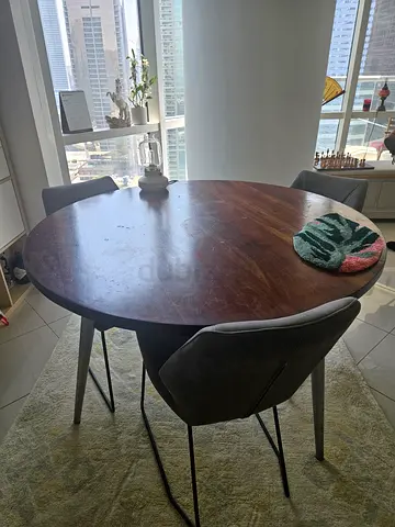 Big solid wooden table with suede chairs