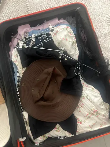 Luggage full with clothes size S/M