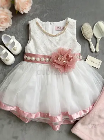 Elegant White Baby Dress with Floral Sash and Pearl Accents