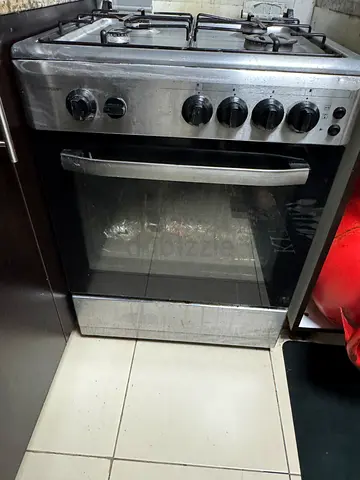 Used stainless steel gas cooker with oven with 4 burners