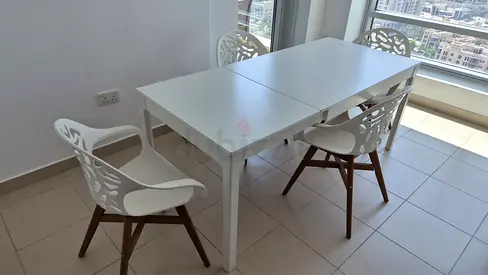 Extendable white dining table with 4 modern chairs - good condition