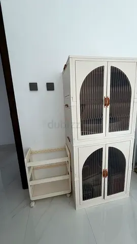 Modern Cream Storage Cabinet with Arched Glass Doors and Rolling Utility Cart