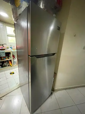 Silver double-door refrigerator (top freezer) - good condition..