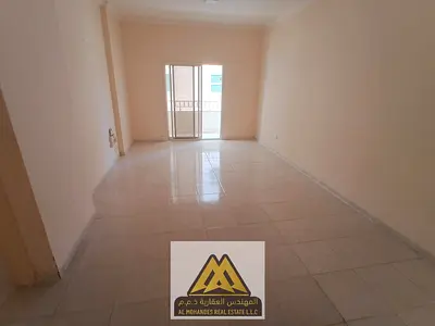 A spacious one-bedroom apartment with a balcony in Al Rashidiya 3, near Grand Mall and Ajman One, c