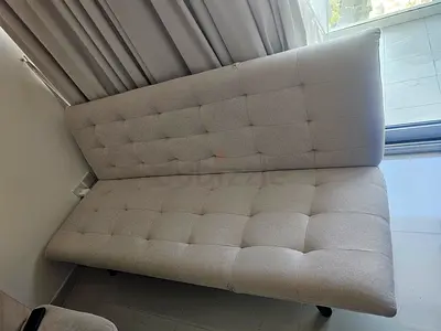 Light beige tufted sofa bed / futon - excellent condition