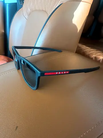 Prada black rectangular sunglasses with red logo - used