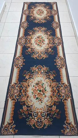 Long narrow floral runner rug - navy background, good used condition