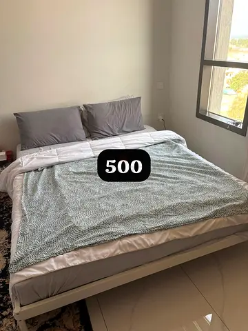 Queen bed frame with mattress and bedding - good condition