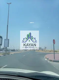 Two adjacent plots for sale in Al Abrak UAQ, 9,000 sqft, corner & middle, residential G+1.