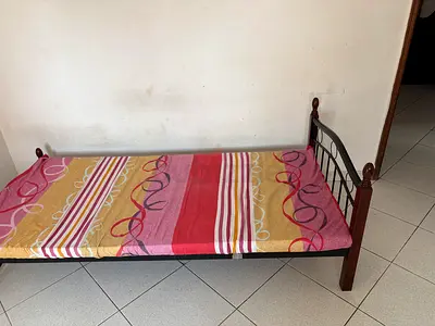 Metal frame single bed with wooden posts – used, good for spare room