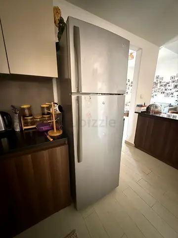 Large double-door stainless steel refrigerator - good working condition