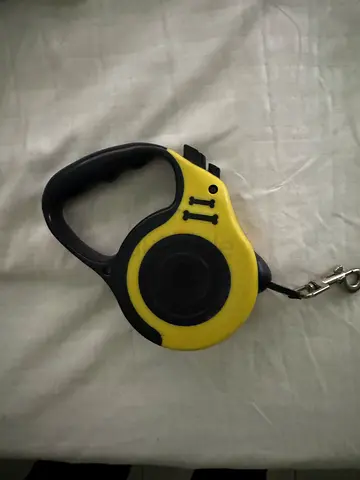 Yellow retractable dog leash - medium (used)